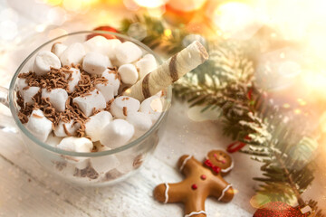Obraz na płótnie Canvas Christmas background. Cup of hot chocolate with marshmallows on a white wooden background.