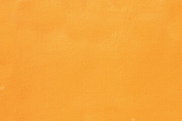 Orange plaster on the wall close-up.