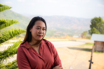 female smile and sitting on chair mountain