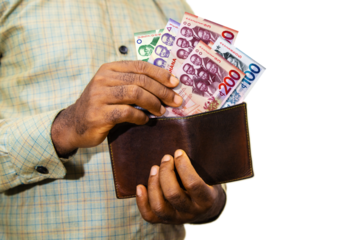 Black person Holding brown wallet
With Ghanaian cedi notes, hand removing money out of wallet isolated on transparent background removing money from wallet