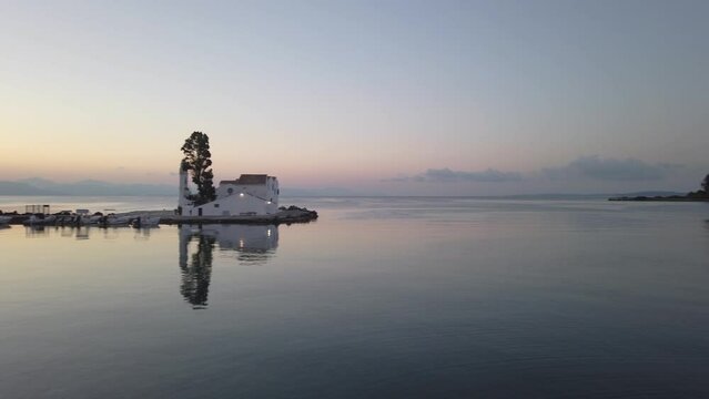 Valcherna Monastery at early morning with ripples on sea water, Korfu Greece