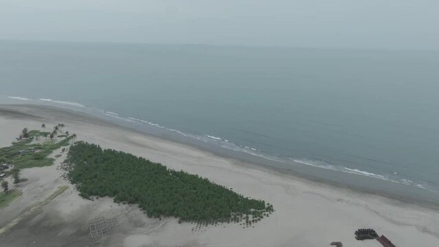 Panoramic image of a beautiful seascape with palm Thai beach and sea wave on the sand. Travel to a tropical paradise, cox's bazar, bangladesh
