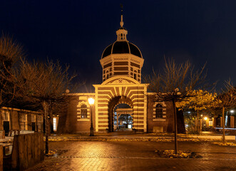 The old city gate Morspoort in Leiden at sunrise.