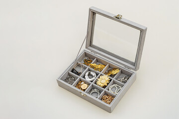 Jewelry box with trendy bijouterie. Stylish silver and golden  rings, chains, necklace, earrings...