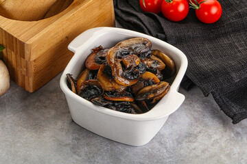 Roasted champignon mushrooms in the bowl