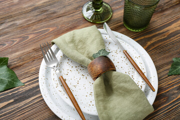 Stylish modern table setting on brown wooden background