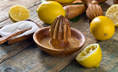 Lemons and squeezer .