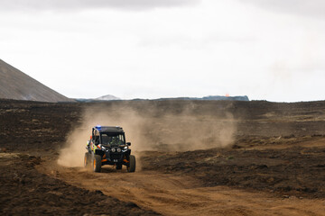 Machines near a volcano in Iceland on lava fields