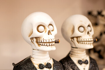 Skeleton in a tuxedo and a cigar in a shop Halloween Costume Store