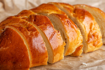 delicious freshly baked bun cut into pieces with close-up