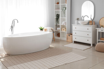 Fototapeta na wymiar Stylish interior of bathroom with bathtub