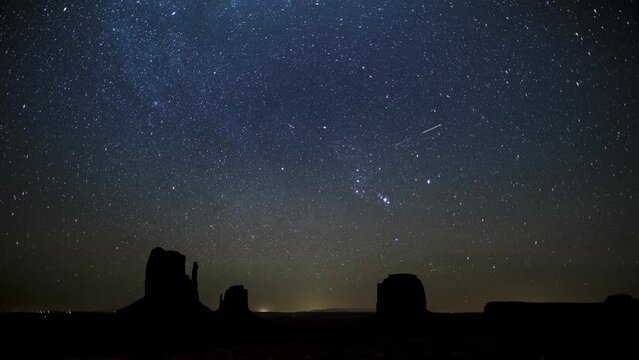 nightscape, night full of stars, Monument Valley, constellation orion rising above West Mitten Butte, East Mitten Butte and Merrick Butte
