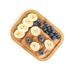 Wooden board of toast with peanut butter, banana and blueberries on white background