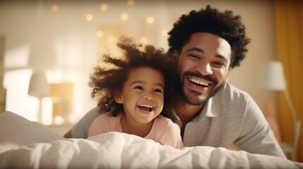 Happy young dad playing games and lifting his adorable little daughter at home, father taking care and have good time with his baby in modern bedroom.