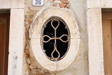 Traditional window with bars in Rovinj, Croatia.