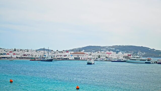 View of Mykonos SeaBus: Bus and Taxi Stations on the Greek Islands. Ships and boats transporting passages in Mykonos, Cyclades islands.