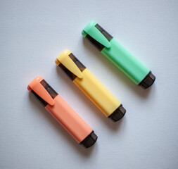 Set of multicoloured office markers on a white background