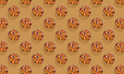 Pattern of colorful heart shaped pasta closeup on orange background