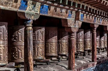 Tibetan prayer wheels at Sakya Monastery also known as Pel Sakya is a Buddhist monastery situated in Sa'gya Town - Tingri county, Tibet - China