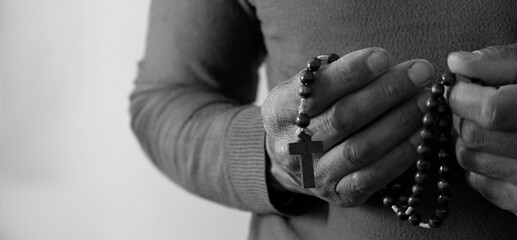 black man praying to God on grey black background with people stock image stock photo
