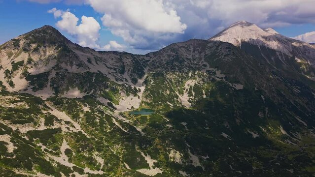 Aerial drone landscape shot of rocky landscape and Vihren peak in Pirin mountain national park.