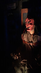 Fototapeta na wymiar Spooky Halloween Costume in a haunted house