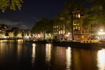 Fototapeta na wymiar Majestic Amsterdam at night. Summer city landscape. Panorama
