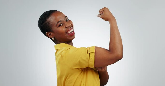 Happy black woman, flex muscle and power in studio for energy or empowerment. Portrait, strong bicep and arm of African person for hard work, smile or funny isolated on white background mockup space