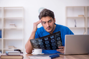 Young male doctor radiologist working in the clinic