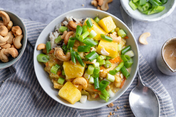 Exotic salad bowl with mango rice and nuts - obrazy, fototapety, plakaty