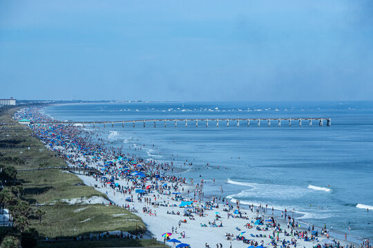 JACKSONVILLE BEACH, FL – OCTOBER 22.  Crowds gather to watch the Blue Angels perform a show over Jacksonville Beach for their Sea & Sky event in Jacksonville Beach, Florida – 22 Oct 2023