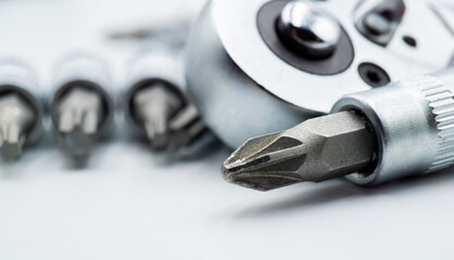Handyman  wrench tool screwdriver bits macro close up on white