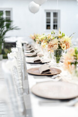 Beautiful table set for an event party or wedding reception . restaurant interior	
