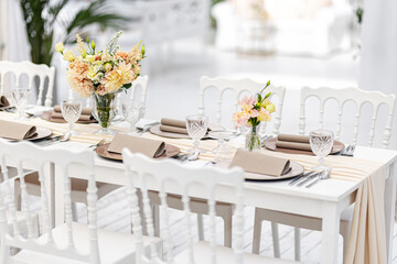 Beautiful table set for an event party or wedding reception . restaurant interior	