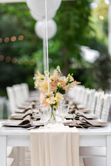 Beautiful table set for an event party or wedding reception . restaurant interior	