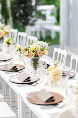 Beautiful table set for an event party or wedding reception . restaurant interior	