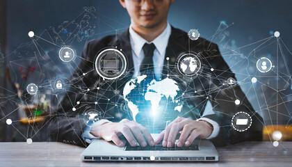 Abstract. Businessman use laptop and synchronize data of business on computer device with global network, Data exchange, Information Transfer, Data science analytics and internet technology