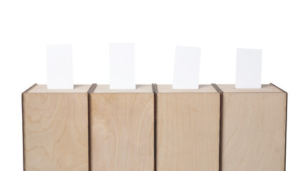 Wooden ballot boxes with votes isolated on white