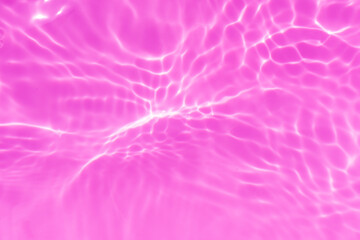 Purple water bubbles with ripples on the surface. Transparent pink colored clear calm water surface texture with splashes and bubbles. Water waves with shining pattern texture background.