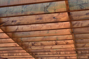 Geometrical shape made of brown wooden board. Wood structure.