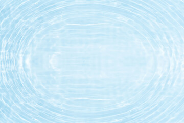 Defocus blurred transparent blue colored clear calm water surface texture with splashes reflection. Trendy abstract nature background. Water waves in sunlight with copy space. Blue watercolor shine.