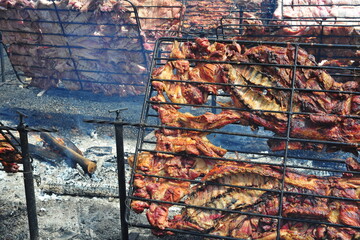 Peruvian "Chancho al Palo" is a popular and delicious Peruvian dish that consists of roast pork cooked on a wooden pole or thorn over an open flame