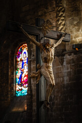 Painted wooden sculpture of Jesus Christ being crucified