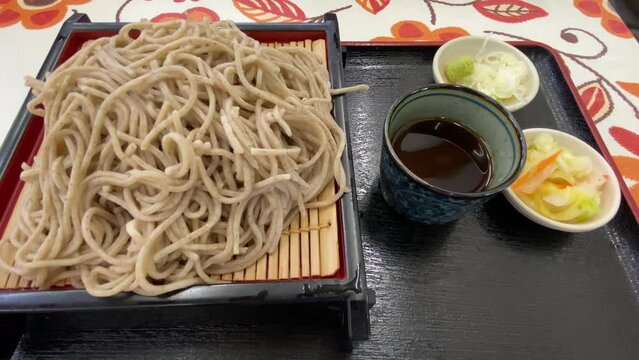 Soba noodle with sliced Japanese leek and wasabi at lunch top shot