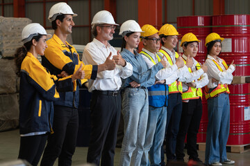 Confident and smiling lineup of factory worker, engineer, manager and foreman stand on-site within...