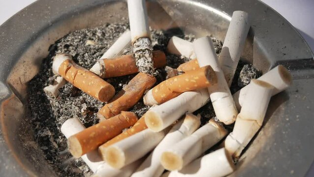 pile of cigarette in ashtray