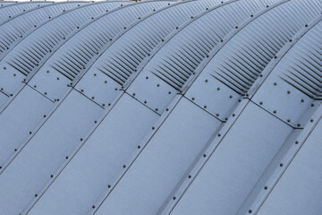 Detail of metal structure and geometric patterns on an aluminum storage shed. Art deco style.