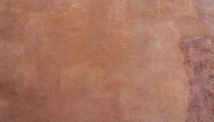 Naklejka premium Abstract background of an exterior reddish brown adobe style textured wall surface