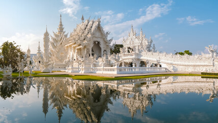 White temple Chiang Rai during sunset, view of Wat Rong Khun or White Temple Chiang Rai, Thailand - obrazy, fototapety, plakaty