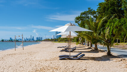 Ban Amphur Beach Pattaya Thailand, beach with beautiful palm trees and a blue ocean in Pattaya
